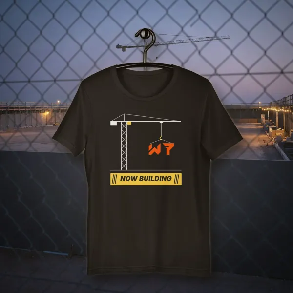 Now Building Tee t shirt in a styled photo