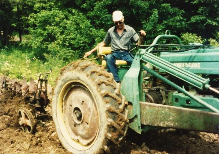 Grandpa Waldo on the John Deere tractor