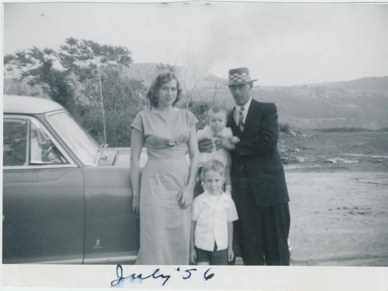 Waldo Chesnut building his family home, July 1956